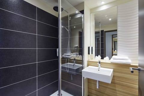 Shower, eco-friendly toiletries, hair dryer, towels