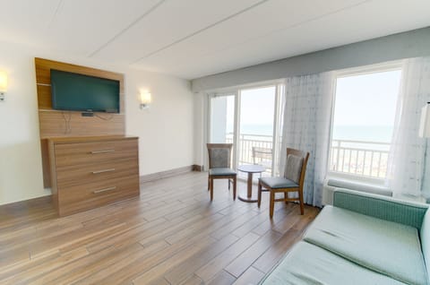 Suite, Oceanfront | Living area | Flat-screen TV