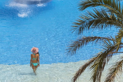 Indoor pool, outdoor pool, pool umbrellas, sun loungers