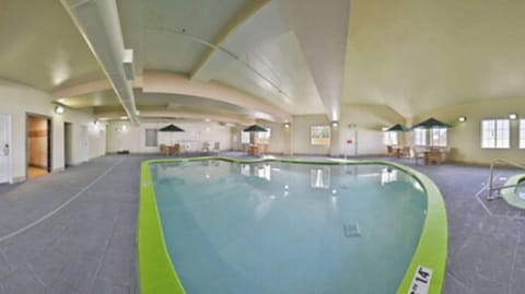 Indoor pool, open 7:00 AM to 10:00 PM, pool umbrellas, sun loungers