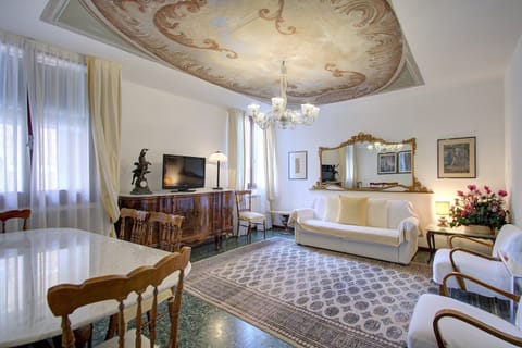 Apartment, Multiple Beds | Living area | Flat-screen TV