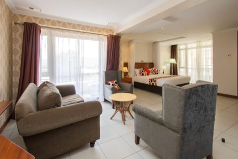Deluxe Double Room | Living area | TV
