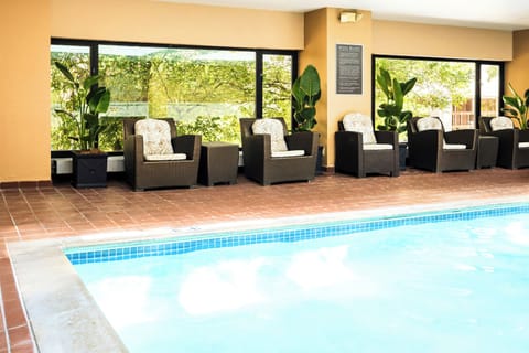 Indoor pool, open 7:00 AM to 10:00 PM, sun loungers