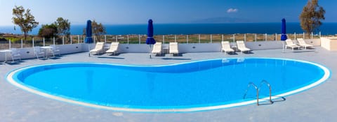 Outdoor pool, open 9:30 AM to 7:00 PM, pool umbrellas, sun loungers