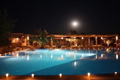 Outdoor pool, open 8:00 AM to 7:00 PM, free cabanas, pool umbrellas