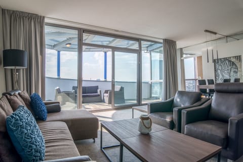 Suite, 1 King Bed (Penthouse) | Living area | 32-inch flat-screen TV with cable channels, TV