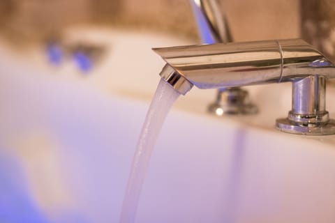 Panoramic Suite, 1 Queen Bed, Jetted Tub, Mountain View | Bathroom | Eco-friendly toiletries, hair dryer, slippers, towels