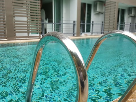 Outdoor pool, open 8:00 AM to 10:00 PM, sun loungers, lifeguards on site