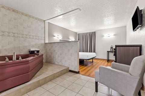 Room, 1 Queen Bed, Jetted Tub | Blackout drapes, free WiFi, bed sheets