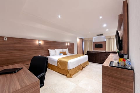 Suite, 1 King Bed, Non Smoking | Down comforters, in-room safe, individually decorated