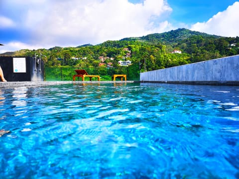 Outdoor pool, pool umbrellas, sun loungers