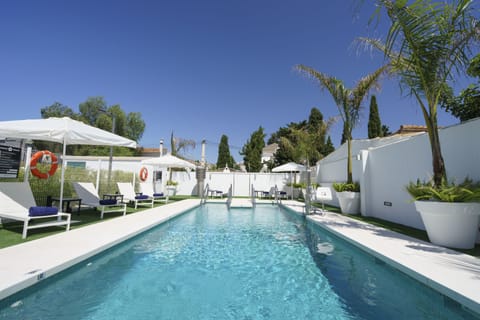 Seasonal outdoor pool, pool umbrellas, sun loungers