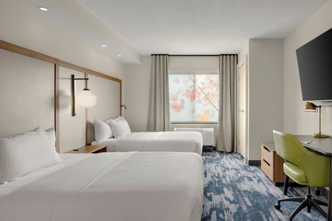 Premium bedding, pillowtop beds, desk, laptop workspace