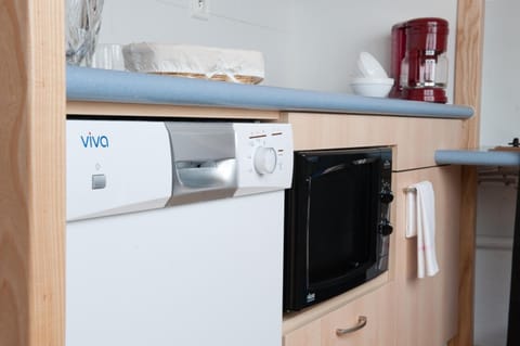 Fridge, stovetop, electric kettle, toaster