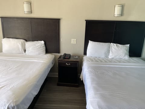 Standard Room, 2 Queen Beds, Non Smoking | Bathroom | Combined shower/tub, free toiletries, towels, soap