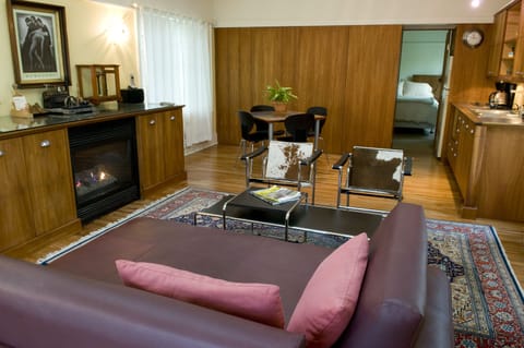 Carriage House | Living area | 28-inch flat-screen TV with satellite channels, TV, heated floors