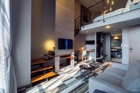 Grand Loft | Down comforters, desk, blackout drapes, soundproofing