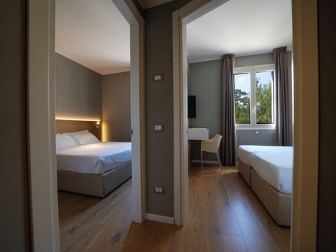 Superior Quadruple Room, 2 Bedrooms | Minibar, in-room safe, desk, bed sheets