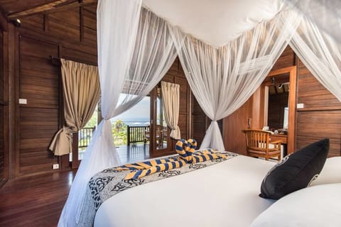 Bungalow, Garden View | Minibar, in-room safe, blackout drapes, free WiFi