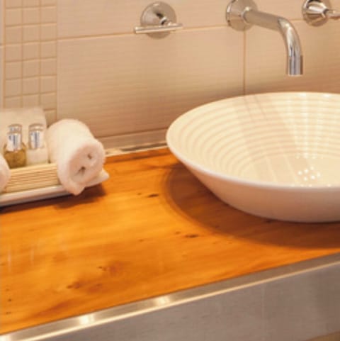 Waterfront Queen Room | Bathroom | Designer toiletries, hair dryer, towels, soap