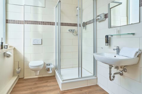 Shower, eco-friendly toiletries, hair dryer, towels