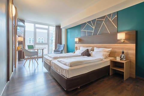 Hypo-allergenic bedding, desk, laptop workspace, blackout drapes