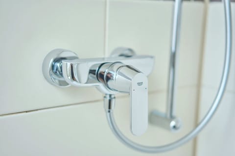 Hypo-allergenic bedding, desk, laptop workspace, blackout drapes