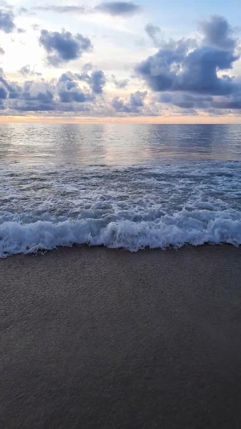 Beach nearby, white sand, surfing