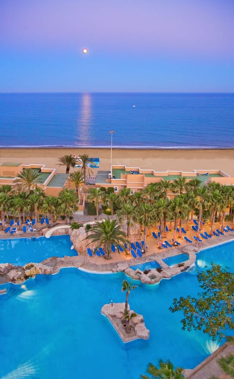 Indoor pool, outdoor pool, pool umbrellas, sun loungers