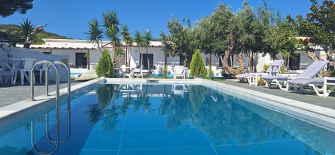 Seasonal outdoor pool, open 10:30 AM to 8:00 PM, pool umbrellas
