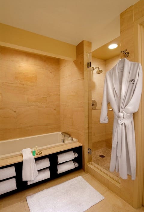 Separate tub and shower, designer toiletries, hair dryer, bathrobes