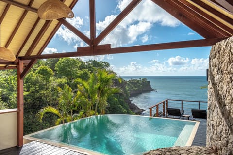 Premium Ocean View Lodge | Minibar, in-room safe, individually decorated, blackout drapes