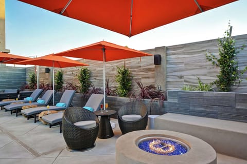 Outdoor pool, open 9:00 AM to 10:00 PM, free cabanas, pool umbrellas