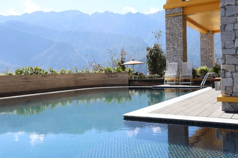 Outdoor pool, pool umbrellas, sun loungers