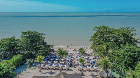 On the beach, white sand, sun loungers, beach umbrellas