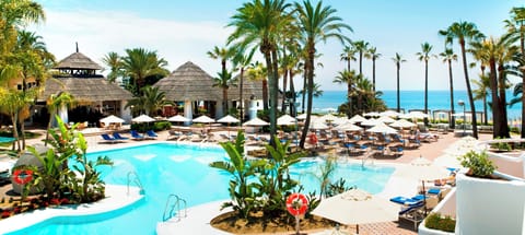 On the beach, sun loungers, beach umbrellas, beach towels