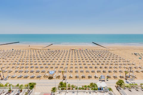 Private beach, white sand, sun loungers, beach umbrellas
