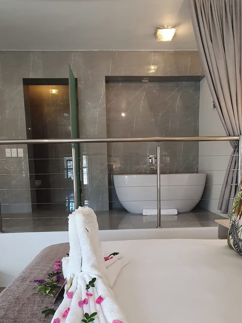 Premier Suite | Bathroom | Designer toiletries, hair dryer, bathrobes, towels
