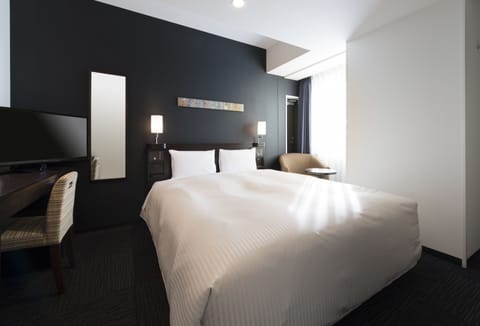 Down comforters, pillowtop beds, in-room safe, desk