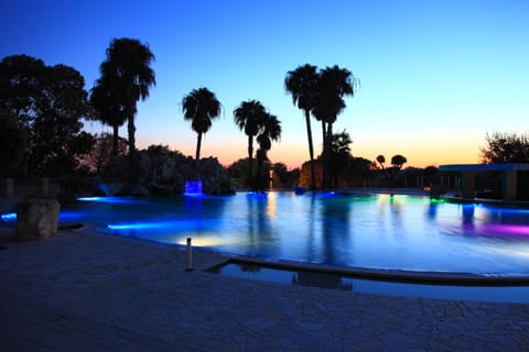 Seasonal outdoor pool, open 9:00 AM to 7:00 PM, pool umbrellas