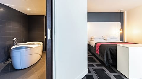 Suite, 1 King Bed with Sofa bed | Minibar, in-room safe, individually furnished, desk