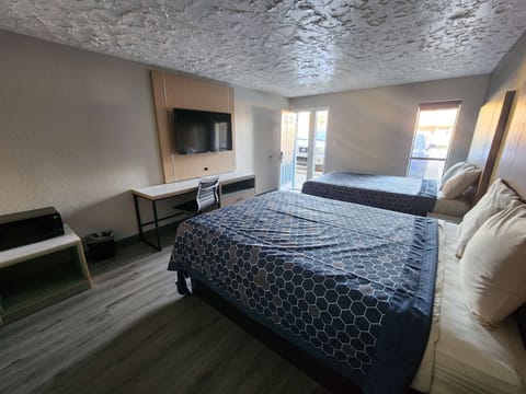 Room, 2 Queen Beds, Non Smoking | Iron/ironing board, WiFi (free), alarm clocks