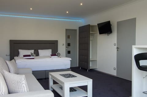 Deluxe Studio, Kitchenette (A - with Terrace) | Desk, soundproofing, iron/ironing board, free cribs/infant beds