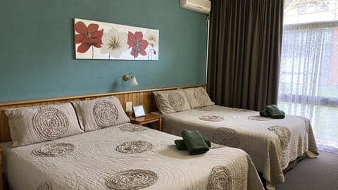 Room 11: Standard Two Queens with 50 inch Smart TV located on Ground Floor | Iron/ironing board, free WiFi, bed sheets