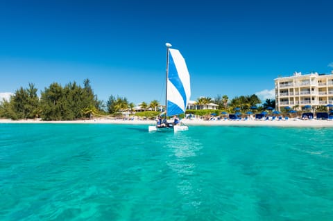 On the beach, white sand, sun loungers, beach umbrellas