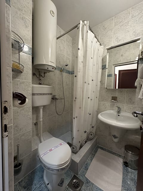 Quadruple Room, Balcony, City View | Bathroom | Shower, free toiletries, hair dryer, towels