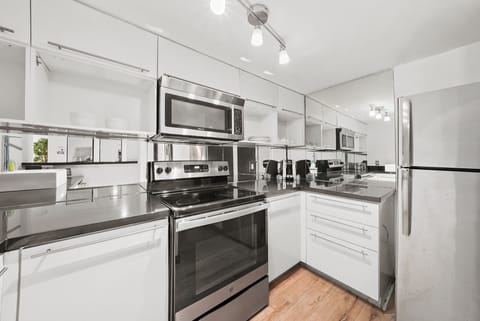 Deluxe Two Bedroom Suite | Private kitchen | Fridge, microwave, oven, stovetop