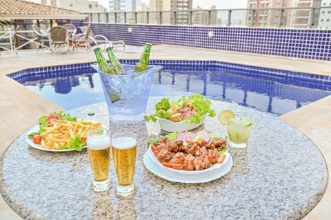Outdoor pool, pool umbrellas, sun loungers