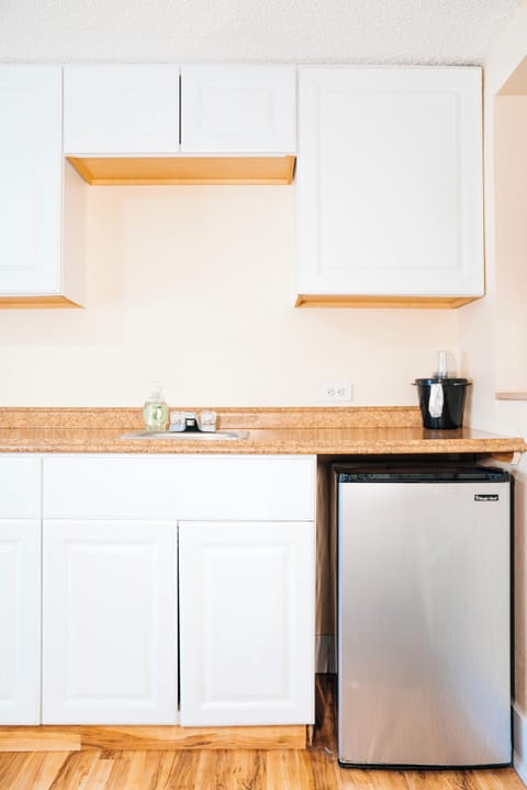 Two Bedroom Family Cottage Triple Queen | Private kitchen | Fridge, microwave, coffee/tea maker