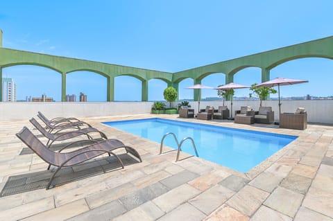 Outdoor pool, pool umbrellas, sun loungers